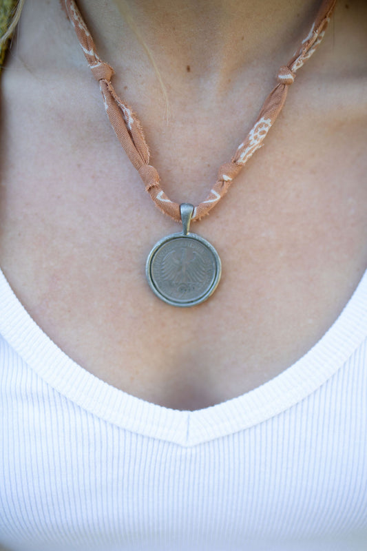 Vintage silver coin + brown