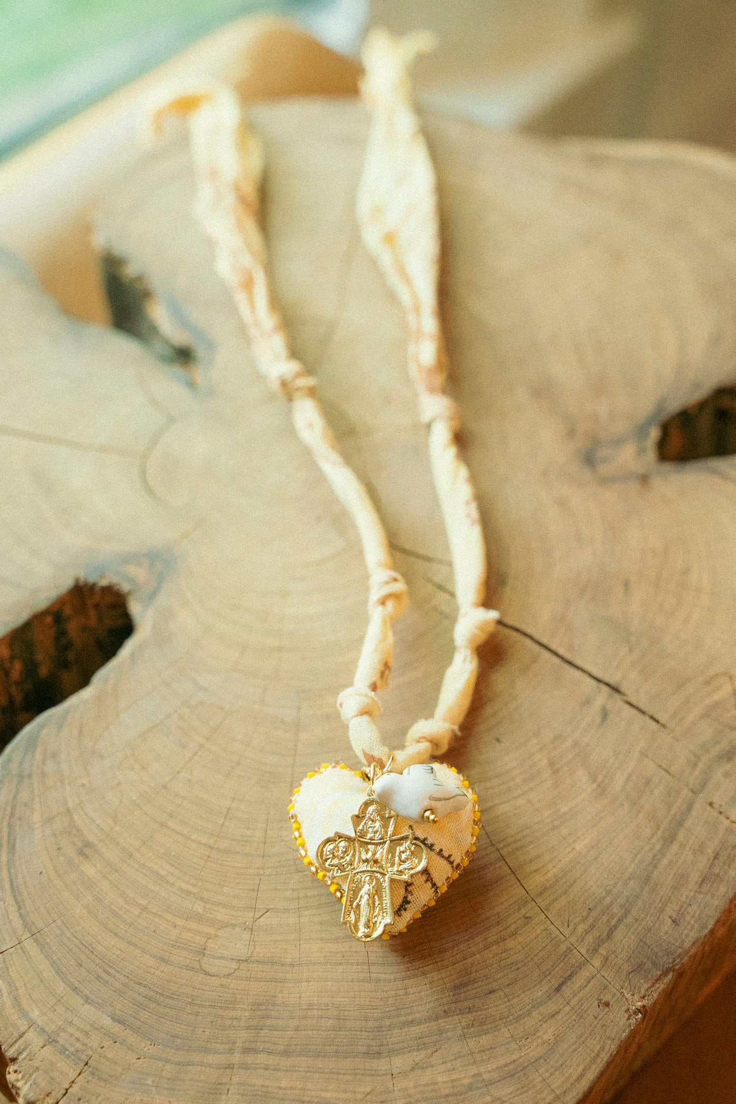 Hand beaded bandana heart (handmade in Paris) w/ layered vintage cross and dove + butter yellow