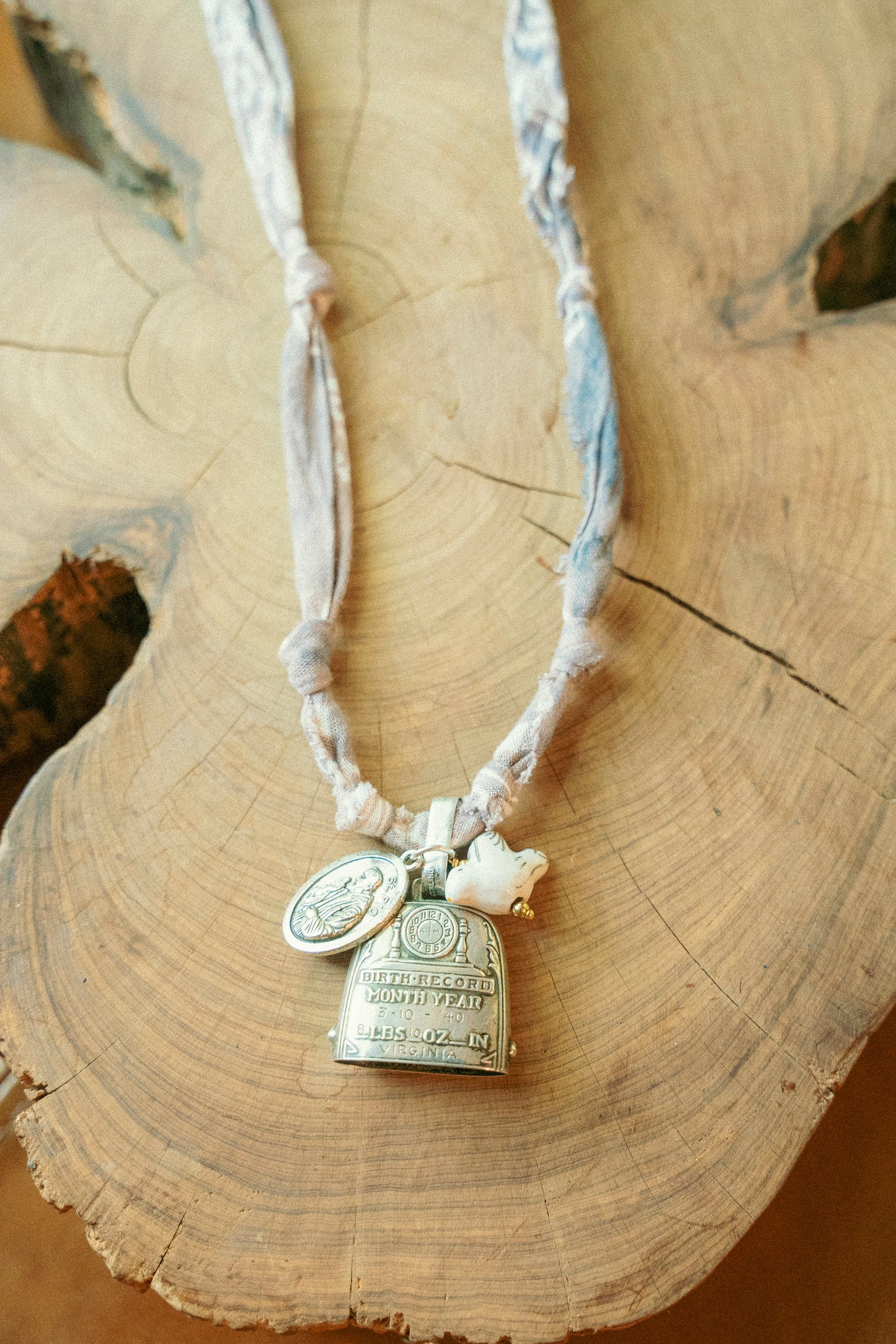 Vintage Sterling baby rattle bell w/ layered charms + faded taupe eggplant bandana