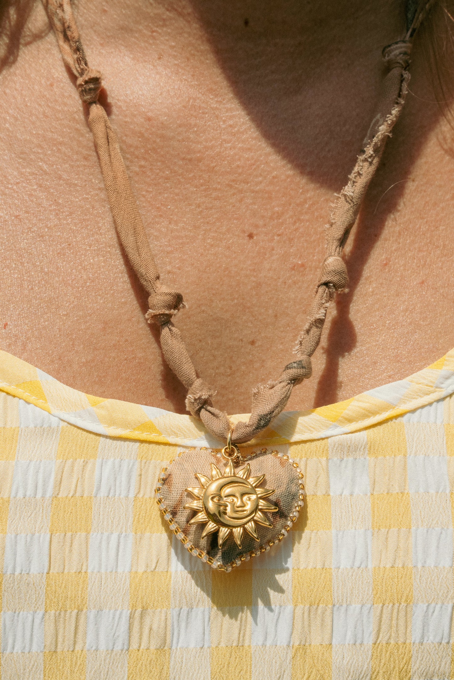 Hand beaded bandana heart (from Paris) layered with European sun