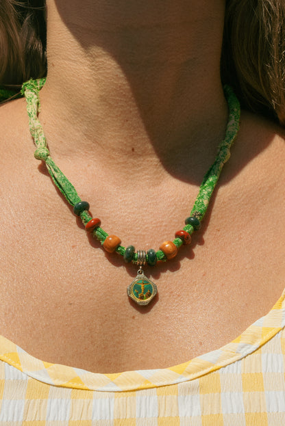 Vintage pendant + beaded green