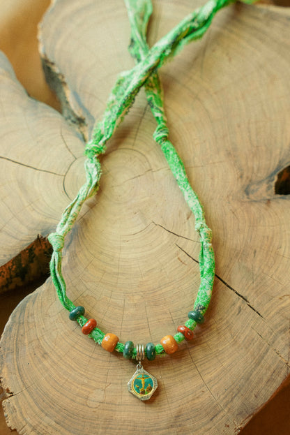 Vintage pendant + beaded green