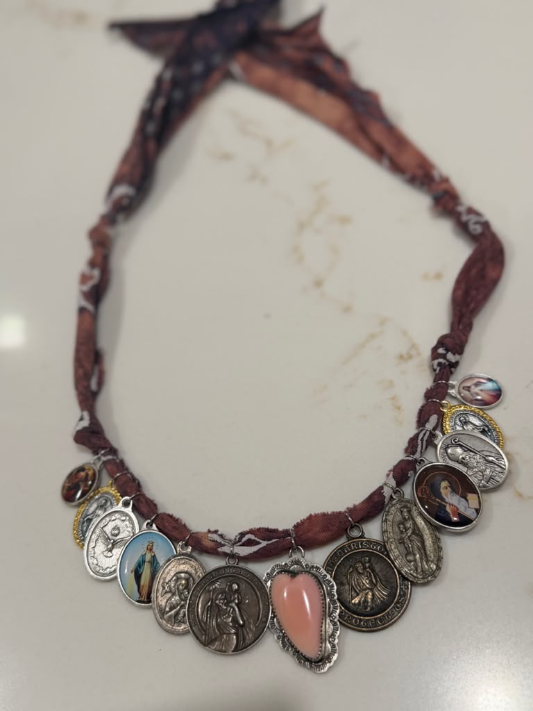 Conch sterling heart with religious charms + faded mauve